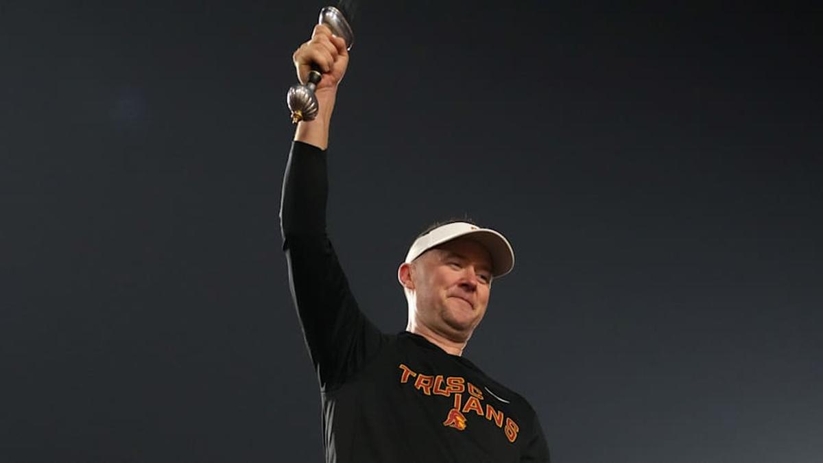  Nov 29, 2025; Los Angeles, California, USA; Southern California Trojans head coach Lincoln Riley leads the Spirit of Troy marching band in a rendition of Tribute to Troy after teh game against the UCLA Bruins at United Airlines Field at Los Angeles Memorial Coliseum. Mandatory Credit: Kirby Lee-Imagn Images | Kirby Lee-Imagn Images 