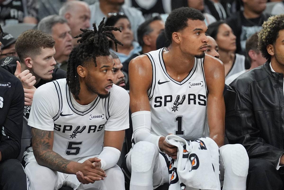 San Antonio Spurs guard Stephon Castle (5) and San Antonio Spurs forward Victor Wembanyama (1) look on against the Brooklyn Nets. 
