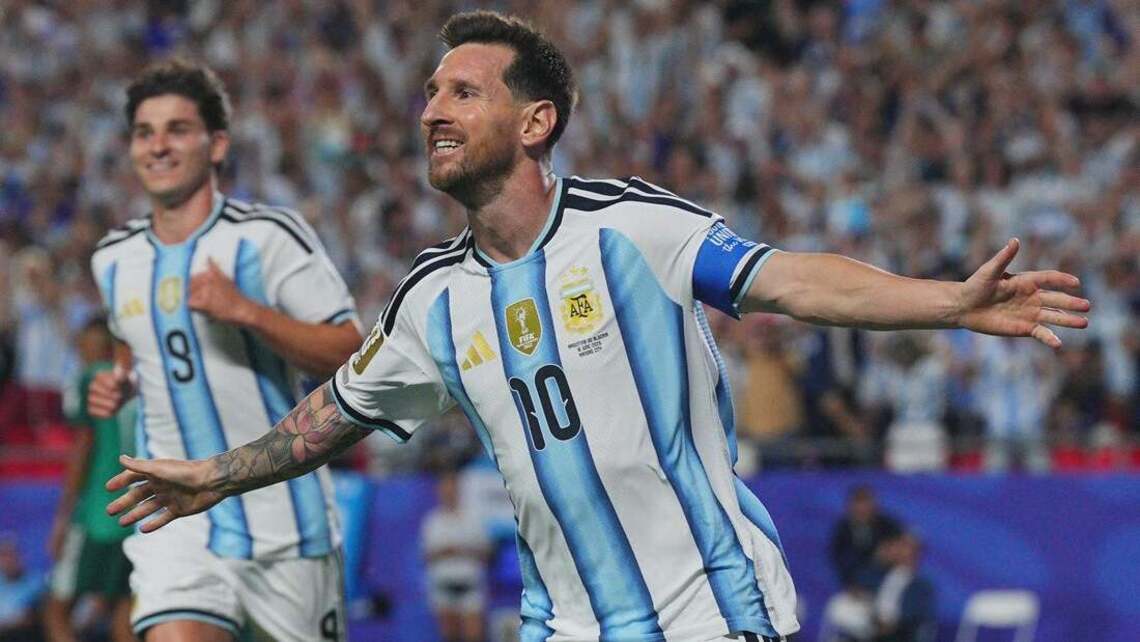 Lionel Messi's history-making hat trick carries Argentina past Algeria 