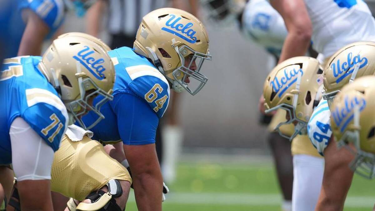  May 2, 2026; Pasadena, CA, USA; A general overall view of helmets at the line of scrimmage as UCLA Bruins center Sam Yoon (64) snaps the ball during the spring game at Rose Bowl. Mandatory Credit: Kirby Lee-Imagn Images | Kirby Lee-Imagn Images 