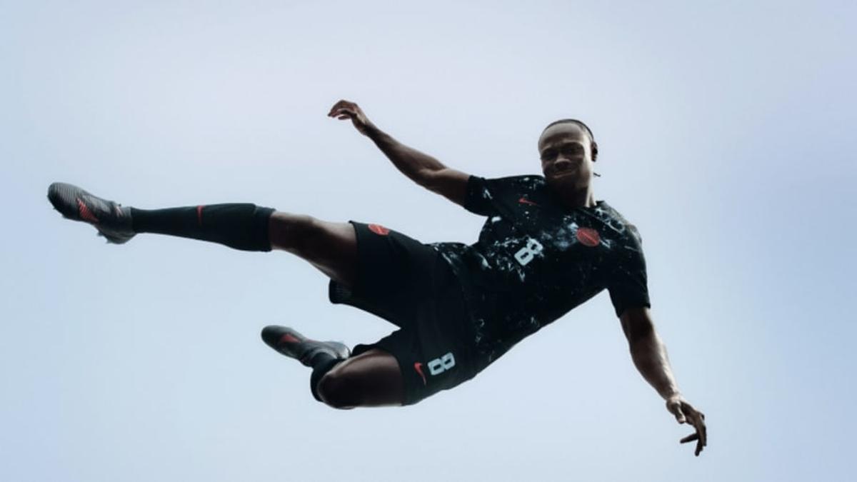  Promise David models Canada's 2026 World Cup away kit. | Canada Soccer/Nike 