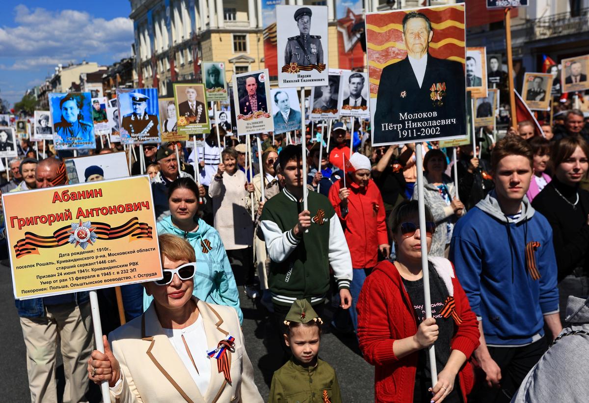 Participants carry portraits of people, including Red Army soldiers and veterans, during the Immortal Regiment march on Victory Day, marking the 81st anniversary of the victory over Nazi Germany in World War Two, in Vladivostok, Russia, May 9, 2026. REUTERS/Tatiana Meel