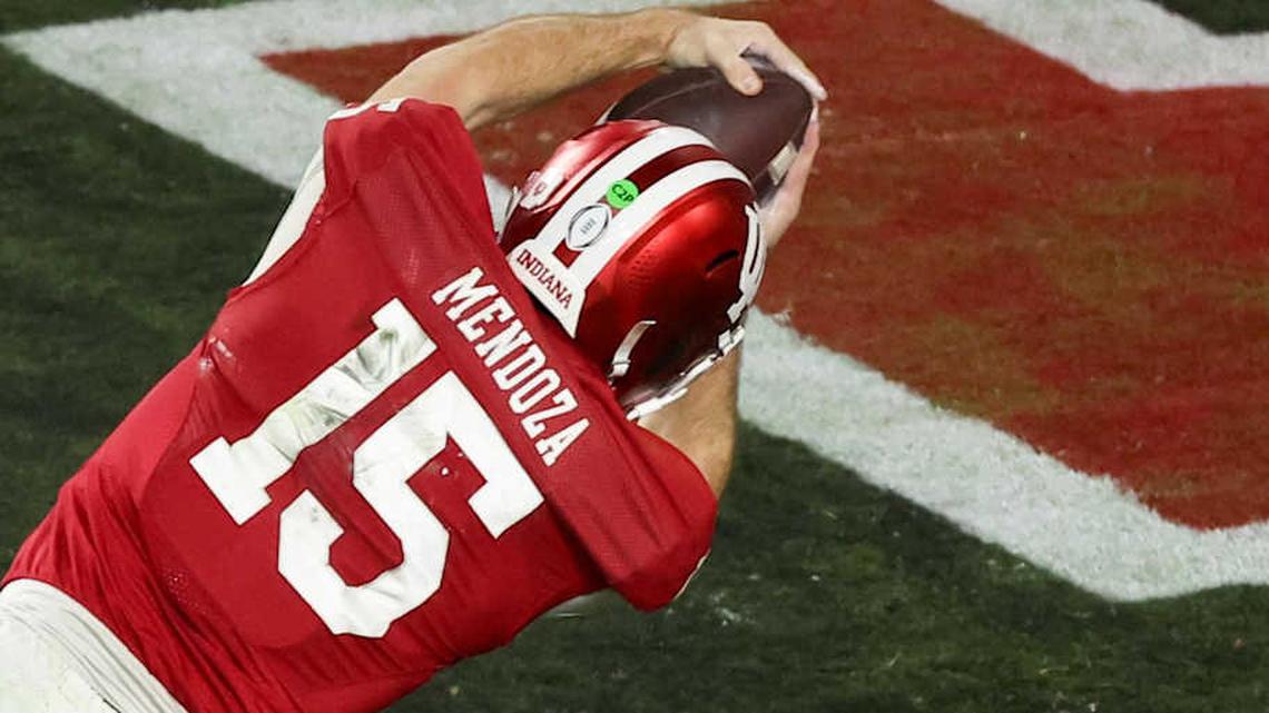  Jan 19, 2026; Miami Gardens, FL, USA; Indiana Hoosiers quarterback Fernando Mendoza (15) carries the ball for a touchdown against the Miami Hurricanes in the fourth quarter during the College Football Playoff National Championship game at Hard Rock Stadium. Mandatory Credit: Kim Klement Neitzel-Imagn Images | Kim Klement Neitzel-Imagn Images 