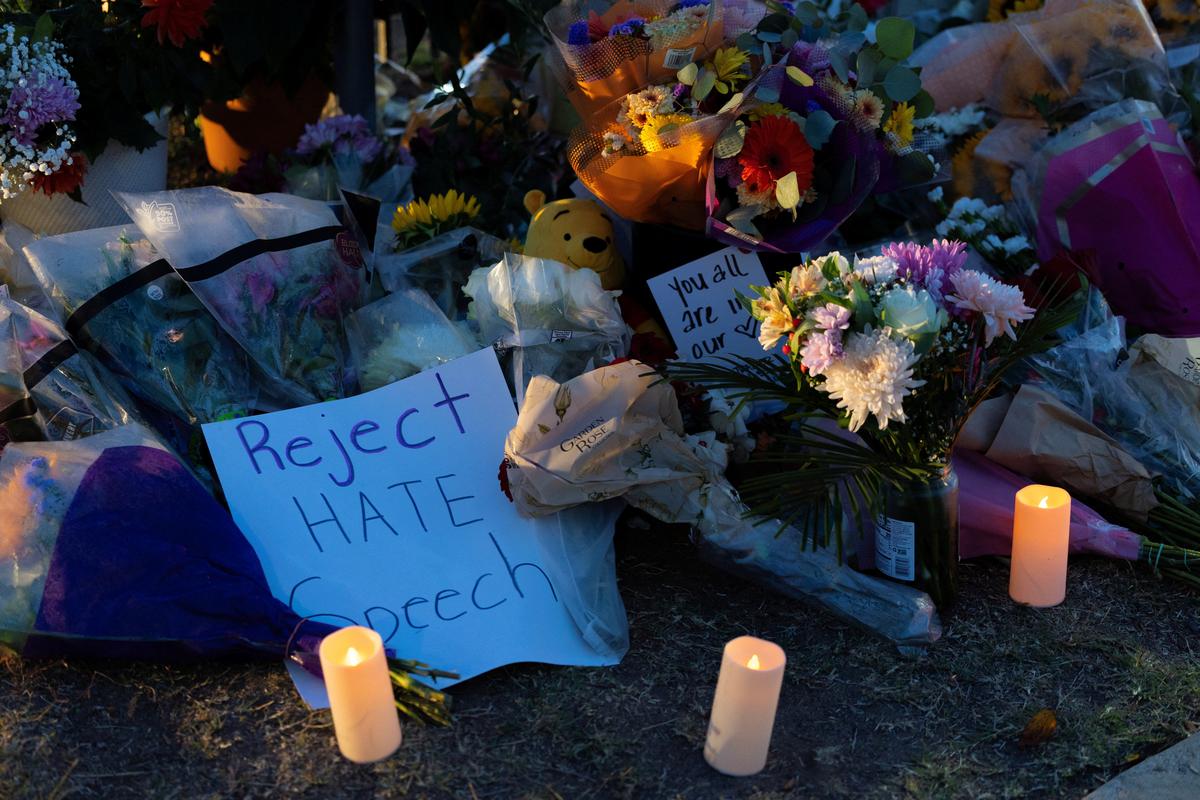 Flowers lie at a memorial outside the Islamic Center of San Diego as the center opens for early morning call to prayer for the first time following a shooting in San Diego, California, U.S., May 20, 2026. REUTERS/Mike Blake