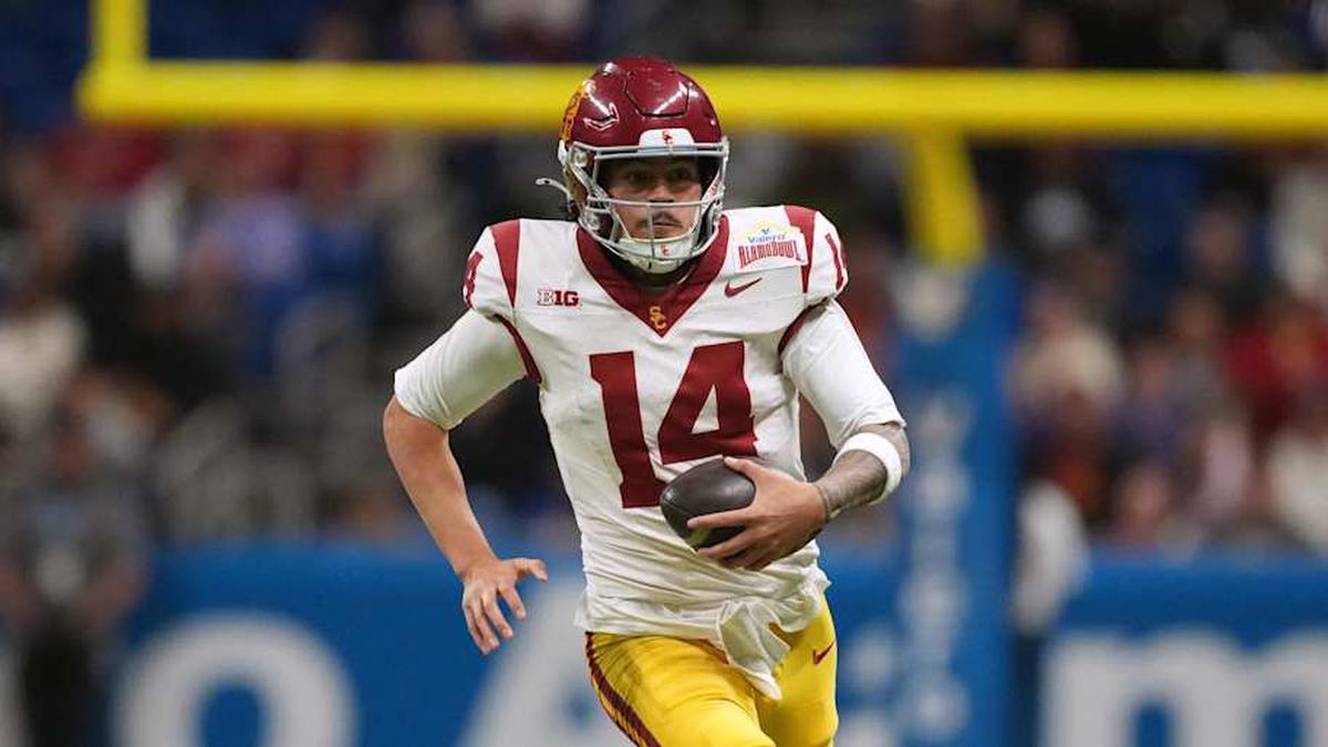  Dec 30, 2025; San Antonio, TX, USA; Southern California Trojans quarterback Jayden Maiava (14) carries the ball against the TCU Horned Frogs in the second half during the Alamo Bowl at Alamodome. Mandatory Credit: Kirby Lee-Imagn Images | Kirby Lee-Imagn Images 