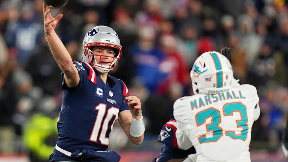  Jan 4, 2026; Foxborough, Massachusetts, USA; New England Patriots quarterback Drake Maye (10) throws a pass against Miami Dolphins cornerback Jason Marshall Jr. (33) during the second half at Gillette Stadium. Mandatory Credit: David Butler II-Imagn Images | David Butler II-Imagn Images 
