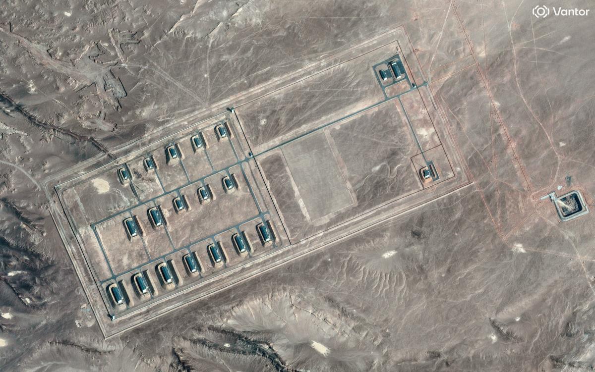A satellite image shows what security analysts say is a fortified weapons storage installation, revealing revetments around the building, a perimeter wall and guard towers, in the Xinjiang Uyghur Autonomous Region, China, March 19, 2026.   Vantor/Handout via REUTERS