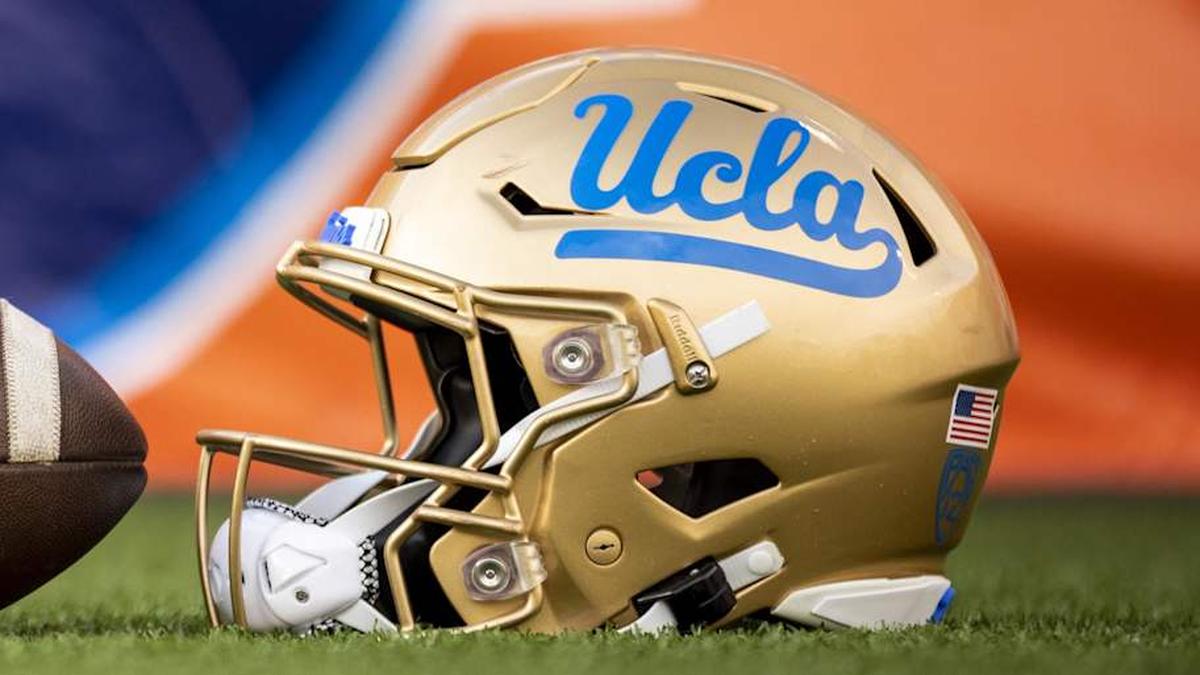  Dec 30, 2022; El Paso, Texas, USA; Helmets of the Pittsburgh Panthers and UCLA Bruins are posed in front of the logo before the 2022 Sun Bowl at Sun Bowl. Mandatory Credit: Ivan Pierre Aguirre-Imagn Images | Ivan Pierre Aguirre-Imagn Images 