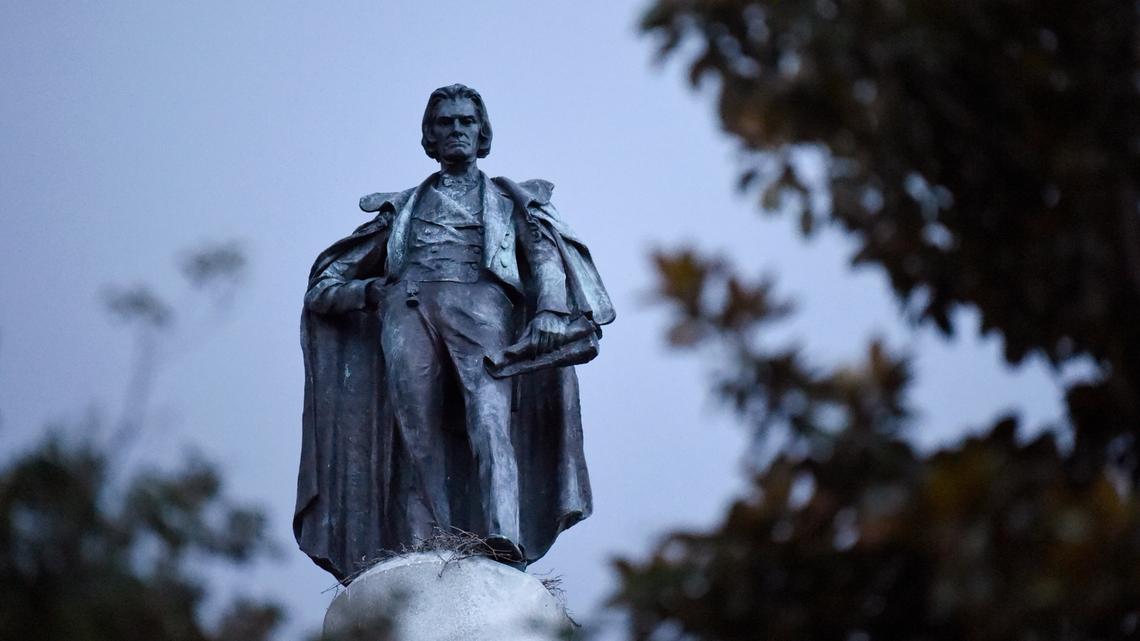 A monument to former U.S. vice president and slavery advocate John C. Calhoun towers over a downtown square Tuesday, June 23, 2020, in Charleston, S.C. Officials in Charleston voted unanimously Tuesday to remove the statue from a downtown square, the latest in a wave of actions arising from protests against racism and police brutality against African Americans. (AP Photo/Meg Kinnard)