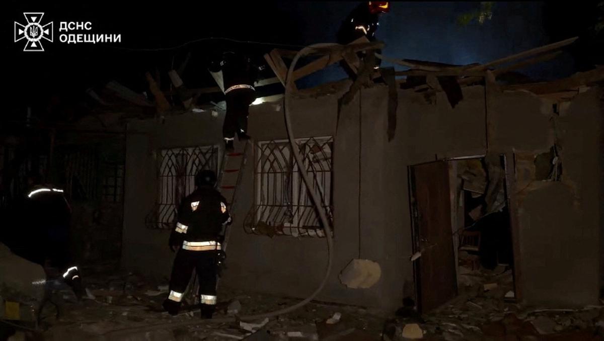 Firefighters work at the site of a Russian drone strike, amid Russia's attack on Ukraine, in a location given as Odesa, Ukraine, in this screengrab obtained from a handout video released on May 18, 2026. State Emergency Service Of Ukraine In Odesa Region/Handout via REUTERS