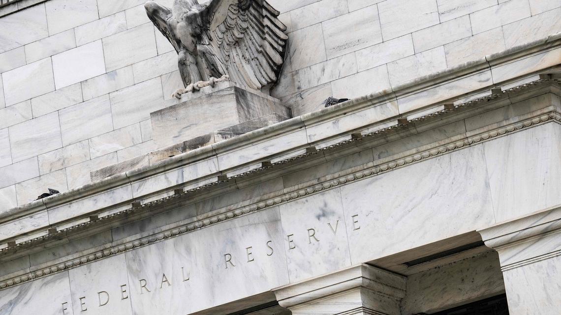 Divided Fed officials hold rates; Powell to stay as governor