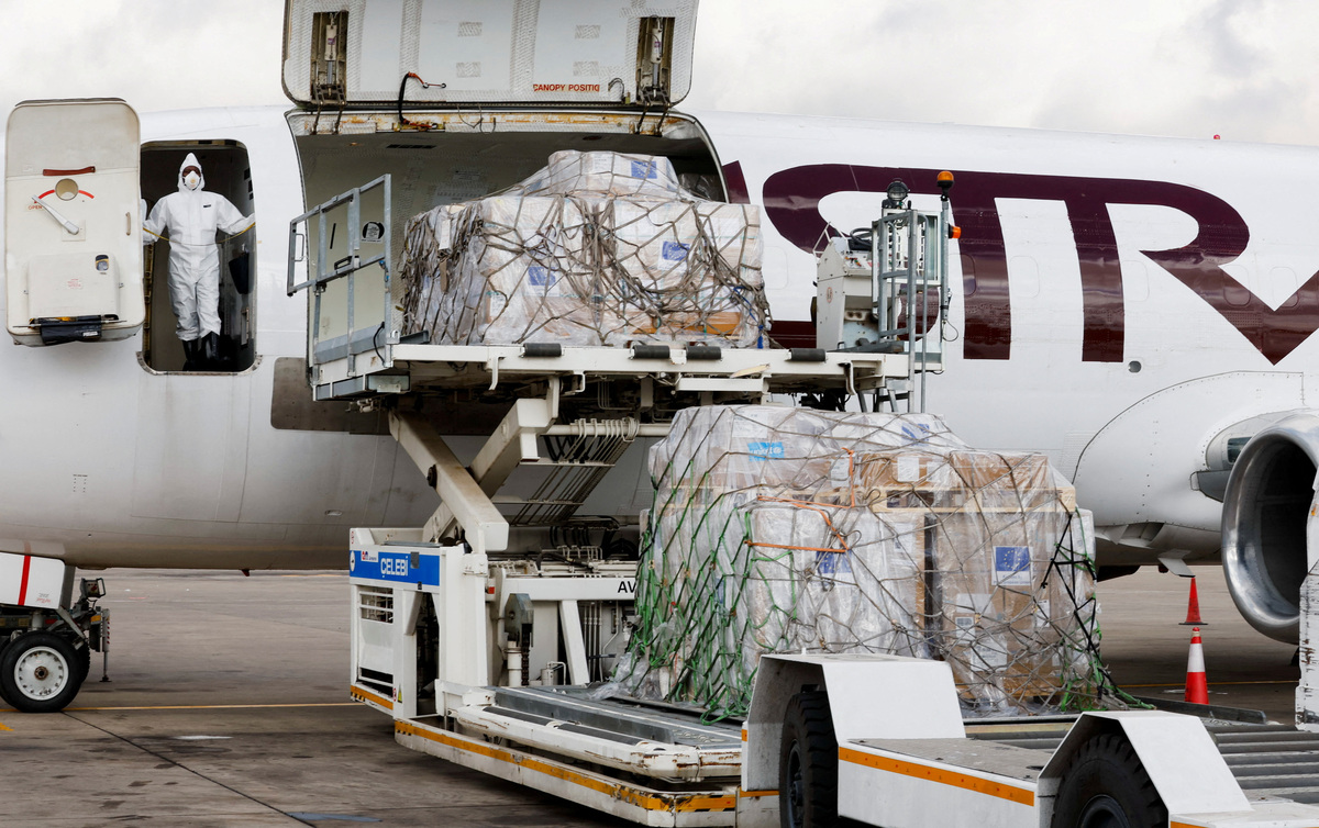 A European Commission Civil Protection and Humanitarian Aid Operations (ECHO) crew member dressed in Personal Protective Equipment (PPE) stands as essential medical supplies and emergency kits are loaded on an aircraft to support the affected regions in Bunia, Ituri province, amidst the Ebola outbreak in the Democratic Republic of Congo, at the Jomo Kenyatta International Airport (JKIA) in Nairobi, Kenya, June 4, 2026. REUTERS/Monicah Mwangi