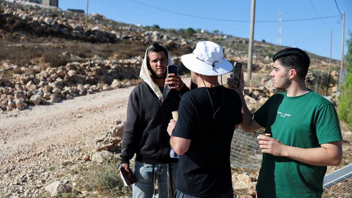 Israeli settler confronts Palestinian American at his besieged West Bank home 