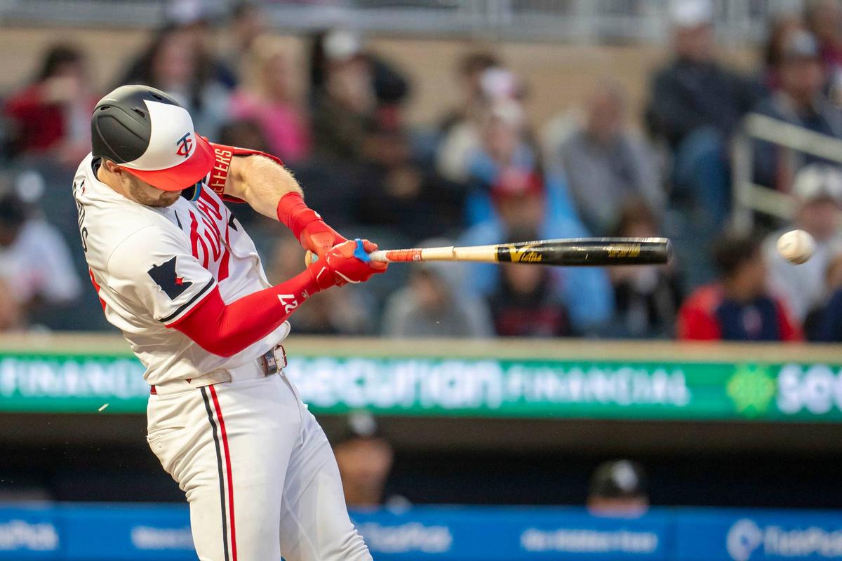  Sep 3, 2025; Minneapolis, Minnesota, USA; Minnesota Twins catcher Ryan Jeffers (27) hits a single against the Chicago White Sox in the fourth inning at Target Field. Mandatory Credit: Jesse Johnson-Imagn Images © Jesse Johnson-Imagn Images