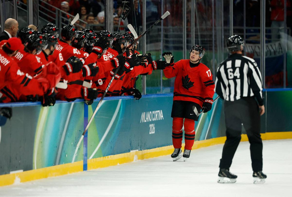  Macklin Celebrini of Canada celebrates scoring their fifth goal with teammates against France in men's ice hockey group A play during the Milano Cortina 2026 Olympic Winter Games at Milano Santagiulia Ice Hockey Arena. Geoff Burke-Imagn Images