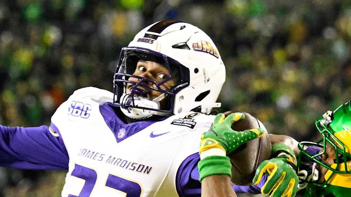  Dec 20, 2025; Eugene, OR, USA; Oregon Ducks wide receiver Jeremiah McClellan (11) makes a catch for a touchdown as James Madison Dukes defensive back DJ Barksdale (32) defends during the second quarter at Autzen Stadium. Mandatory Credit: Troy Wayrynen-Imagn Images | Troy Wayrynen-Imagn Images 