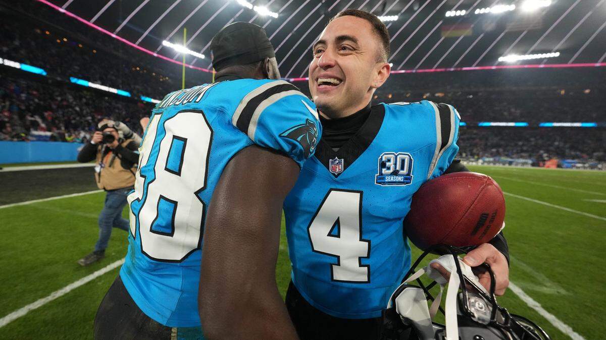 Nov 10, 2024; Munich, Germany; Carolina Panthers place kicker Eddy Pineiro (4) celebrates with linebacker Thomas Incoom (48) after kicking a 36-yard field goal in overtime against the New York Giants during the 2024 NFL Munich Game at Allianz Arena.
