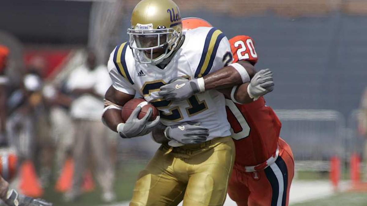  Sep 11, 2004; Champaign, IL, USA; FILE PHOTO; UCLA Bruins running back Maurice Jones-Drew (21) carries the ball against the Illinois Fighting Illini at Memorial Stadium. Mandatory Credit: Peter Brouillet-Imagn Images | Peter Brouillet-Imagn Images 