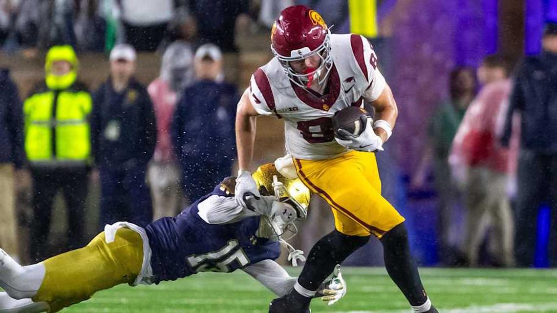  Oct 18, 2025; South Bend, Indiana, USA; Southern California Trojans tight end Lake McRee (87) avoids a tackle by Notre Dame Fighting Irish cornerback Leonard Moore (15) during the second half at Notre Dame Stadium. Mandatory Credit: Michael Caterina-Imagn Images | Michael Caterina-Imagn Images 