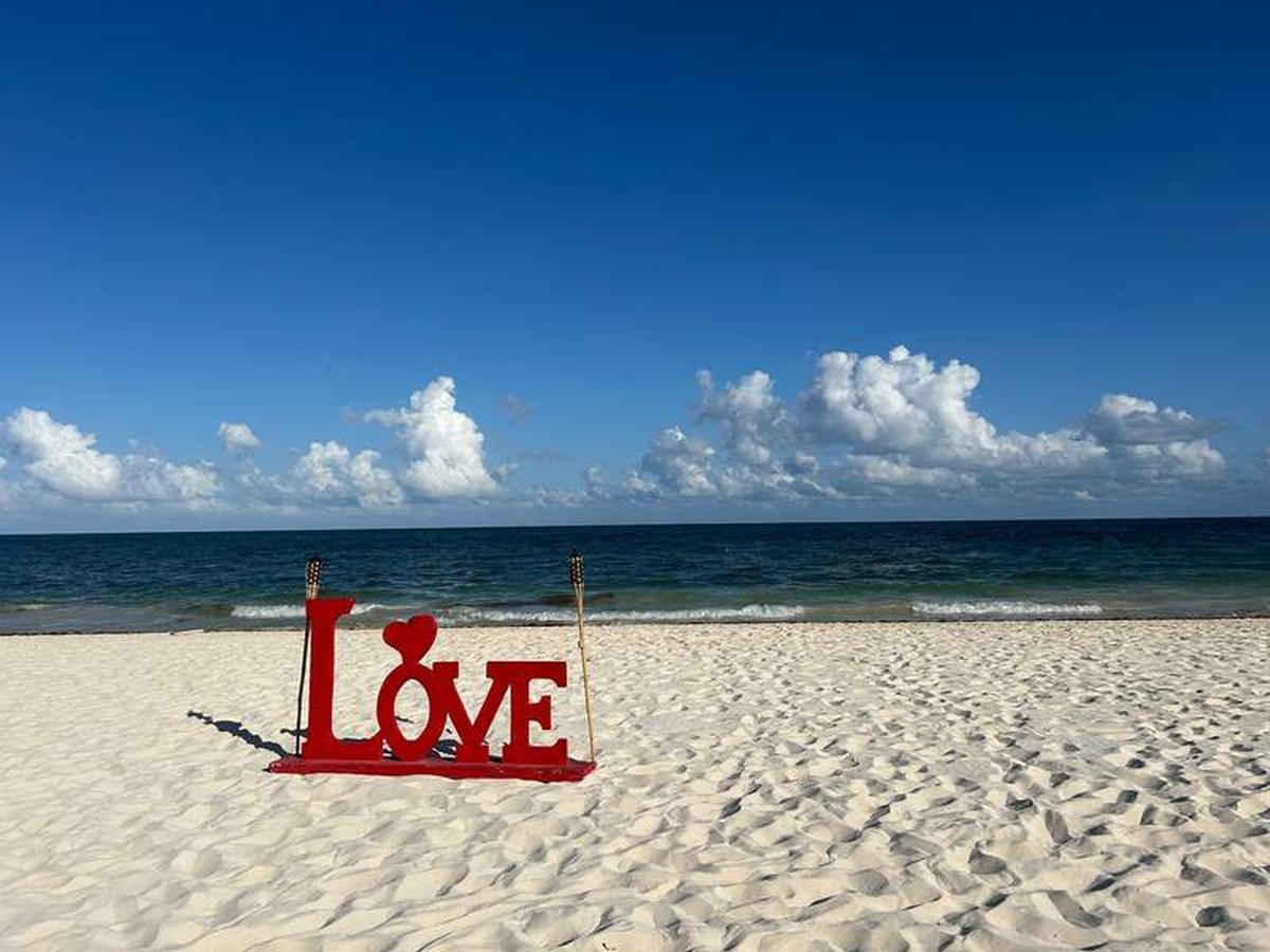  Enjoy a romantic dinner on the beach with this LOVE sign in the sand that's perfect for social media photos. Photo credit: Bethany Kandel 