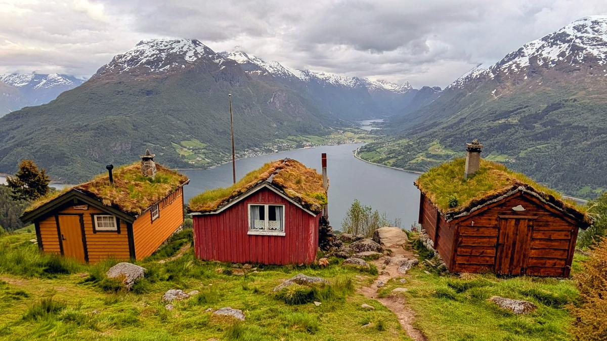 Rakssetra is a group of tiny sod-roofed cabins in a mountainside meadow with a view of Nordfjord, near Stryn, Norway.
