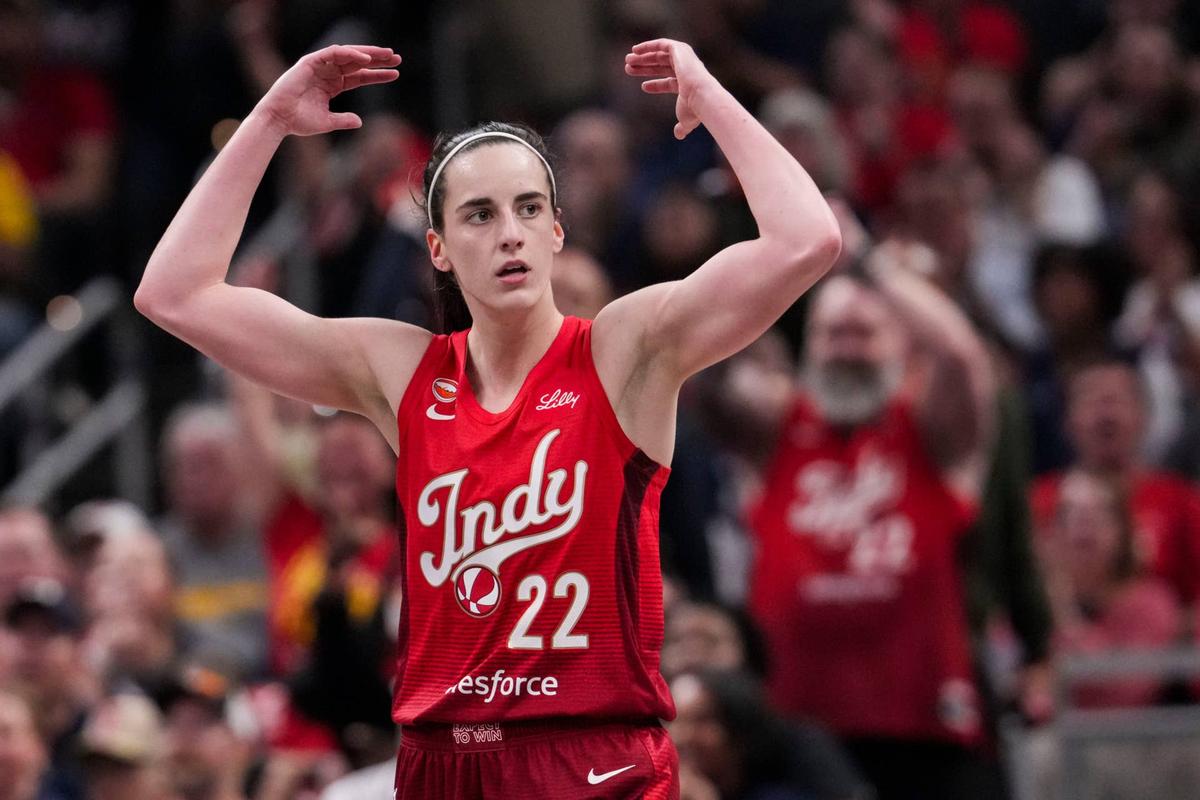  Indiana Fever guard Caitlin Clark (22) gets the crowd excited Saturday, May 9, 2026, during the second half of the Fever's season opener game at Gainbridge Fieldhouse in Indianapolis. The Dallas Wings defeated the Indiana Fever, 107-104. 