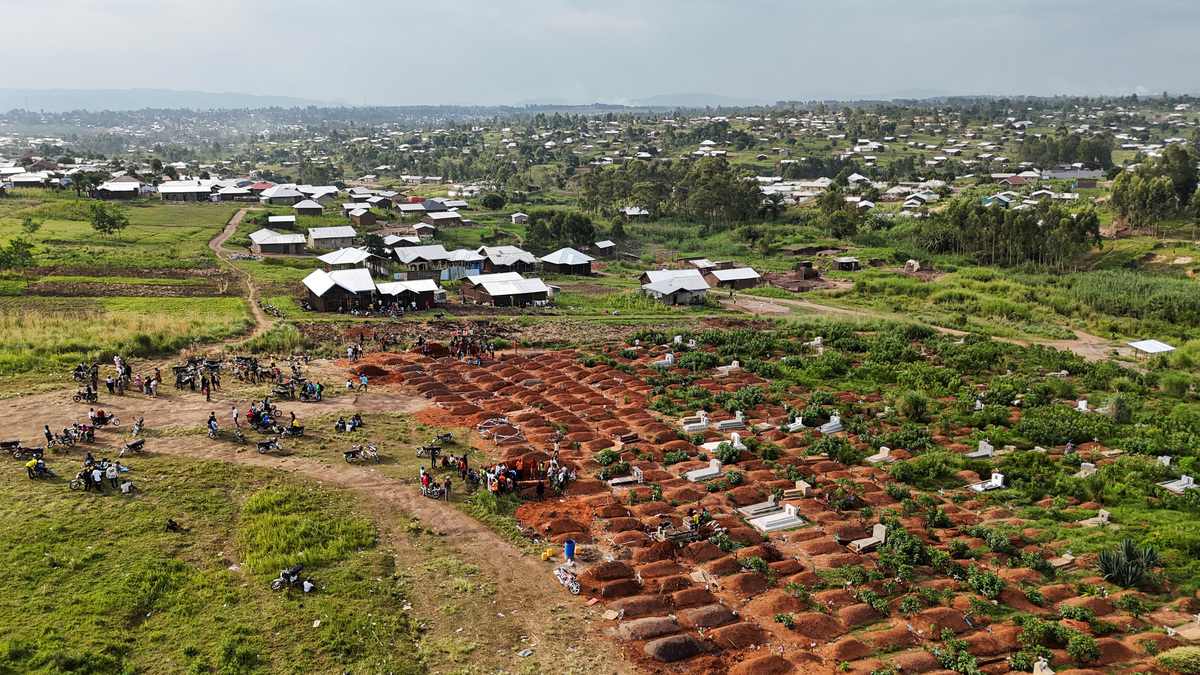 A drone view of displaced people from the Kigonze camp attending the burial of Ebola victims at Nyamurongo Cemetery, one month after an outbreak was declared, in Bunia, eastern Democratic Republic of Congo, June 18, 2026. REUTERS/Gradel Muyisa Mumbere