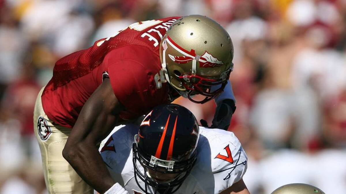  Nov 4, 2006; Tallahassee, FL, USA: Florida State Seminoles safety (3) Myron Rolle hits Virginia Cavaliers tight end (86) Tom Santi as Seminoles linebackers (7) Buster Davis, and (83) Lawrence Timmons assist on the tackle during the 2nd quarter at Doak Campbell Stadium in Tallahassee, FL. Mandatory Credit: Jason Parkhurst-USA TODAY Sports Copyright © 2006 Jason Parkhurst | IMAGN IMAGES via Reuters Connect 