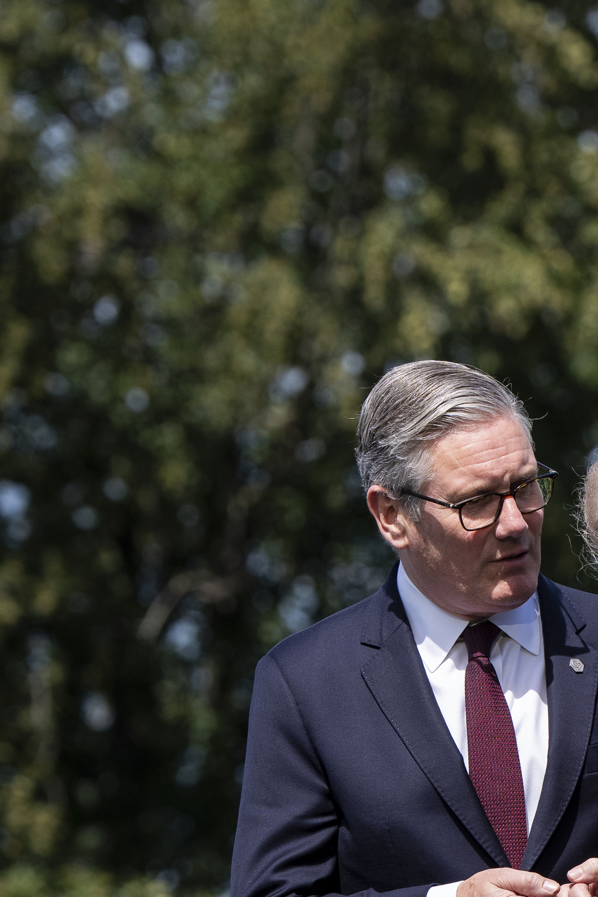 President Donald Trump, right, speaks with Prime Minister Keir Starmer of the United Kingdom as world leaders gather for an official photo at the G7 Summit in Evian-les-Bains, France, June 16, 2026. (Haiyun Jiang/The New York Times)