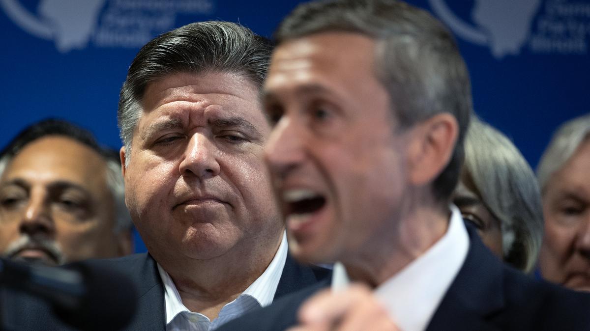 Illinois Gov. JB Pritzker listens as Ken Martin, chairman of the Democratic National Committee, speaks during a press conference with Texas Democrats at the International Union of Painters and Allied Trades union hall on Aug. 05, 2025, in Aurora, Illinois. (Scott Olson/Getty Images/TNS)