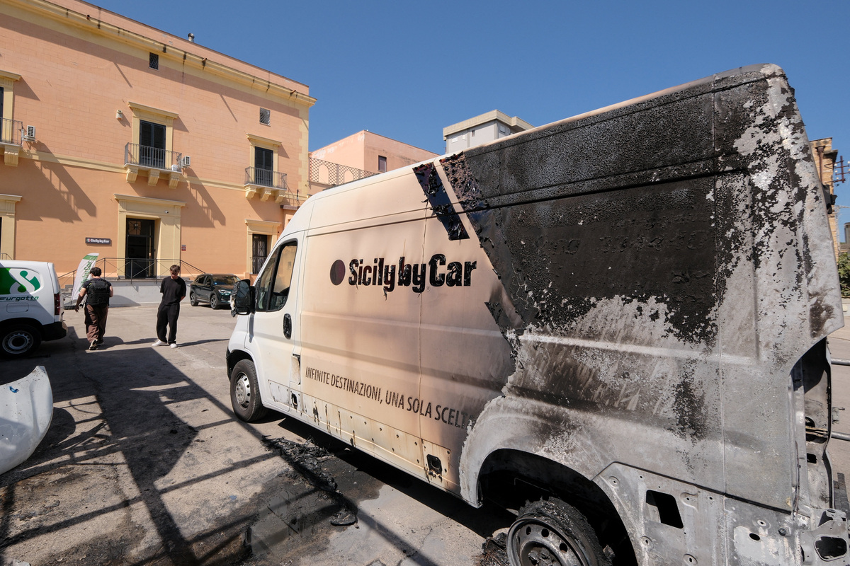 A burned vehicle sits at a depot of Italian car rental company Sicily by Car, after a string of attacks against the company, in the San Lorenzo district of Palermo, Sicily, Italy, June 11, 2026. REUTERS/Igor Petyx