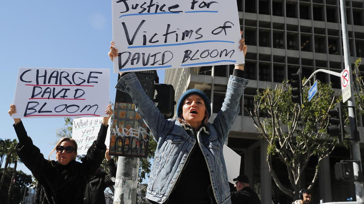 Victims of David Bloom, the one-time Wall Street Whiz Kid financial scammer, protest outside the District Attorney's office demanding that charges be filed, on March 2, 2023, in Los Angeles. (Robert Gauthier/Los Angeles Times/TNS)