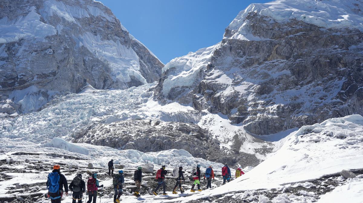 Members of an expedition team hike at Khumbu Icefall, as the route to Mount Everest Camp One has not yet been opened for the season in Solukhumbu district, also known as the Everest region, Nepal, April 22, 2026. REUTERS/Purnima Shrestha