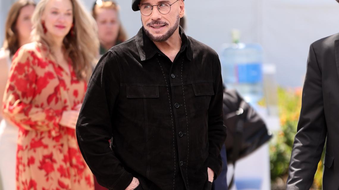 John Travolta Addresses Viral Cannes Look With Beret and Glasses 