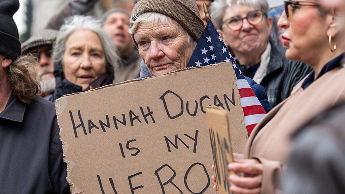 Janice Wilberg protests the arrest of Milwaukee County Circuit Judge Hannah Dugan outside the Milwaukee Federal Building and U.S. Courthouse on Friday. FBI agents arrested Dugan on charges of obstructing immigration agents by steering an undocumented immigrant through a side door in her courtroom while the agents waited in a public hallway to apprehend him.
