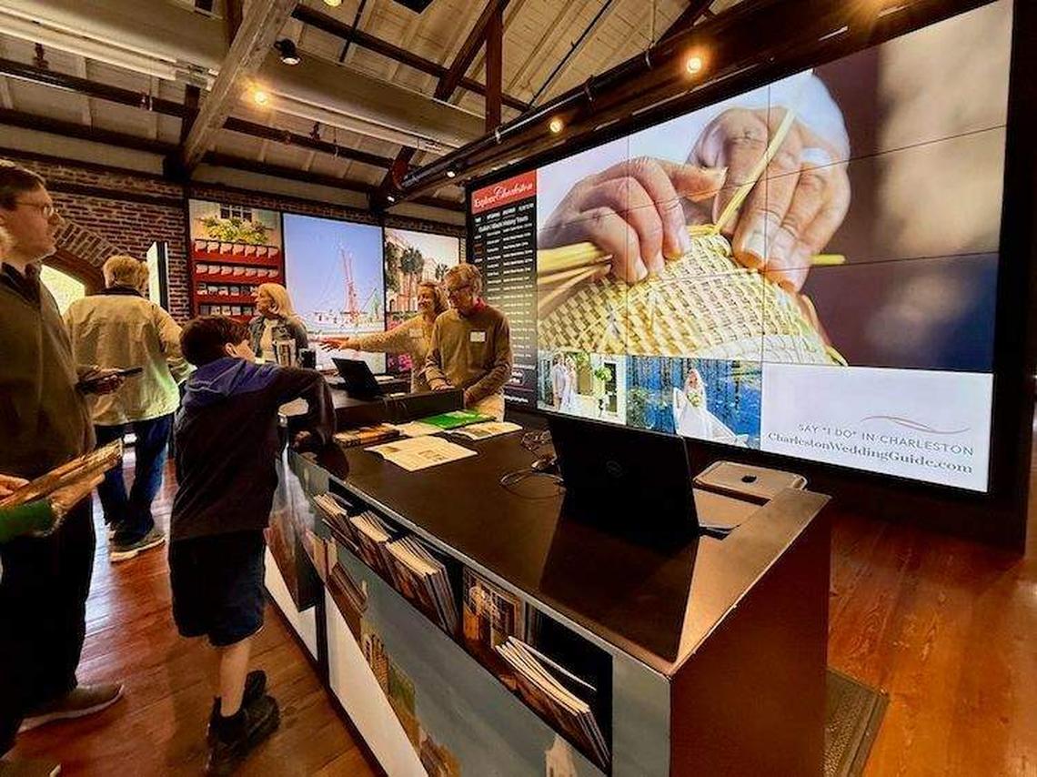  Inside the Charleston Visitors Center, guests browse interactive exhibits while staff help answer questions and plan itineraries. Photo credit: Sharon Kurtz 