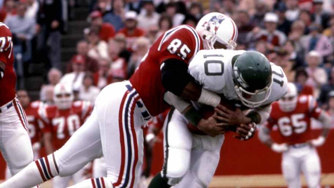 Oct 28, 1984; Foxboro, MA, USA; FILE PHOTO; New York Jets quarterback Pat Ryan (10) is tackled by New England Patriots defensive end Julius Adams (85) at Foxboro Stadium. Mandatory Credit: Dick Raphael-Imagn Images | Dick Raphael-Imagn Images 