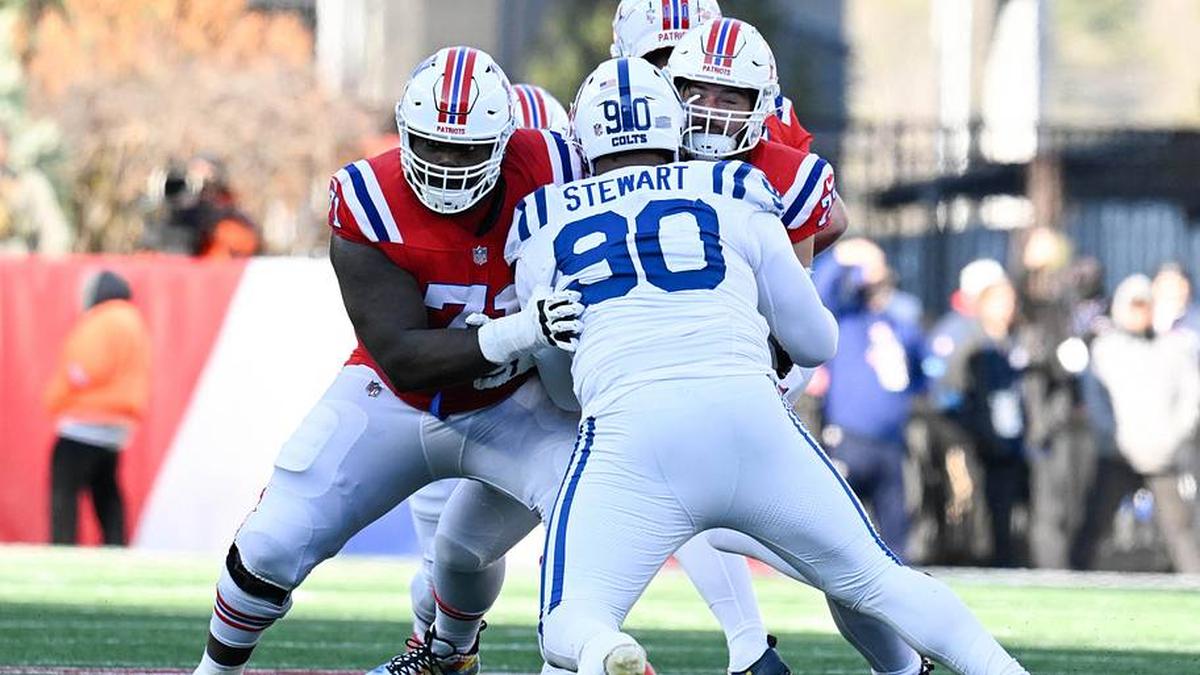  Dec 1, 2024; Foxborough, Massachusetts, USA; New England Patriots offensive tackle Mike Onwenu (71) blocks Indianapolis Colts defensive tackle Grover Stewart (90) during the first half at Gillette Stadium. Mandatory Credit: Eric Canha-Imagn Images | Eric Canha-Imagn Images 