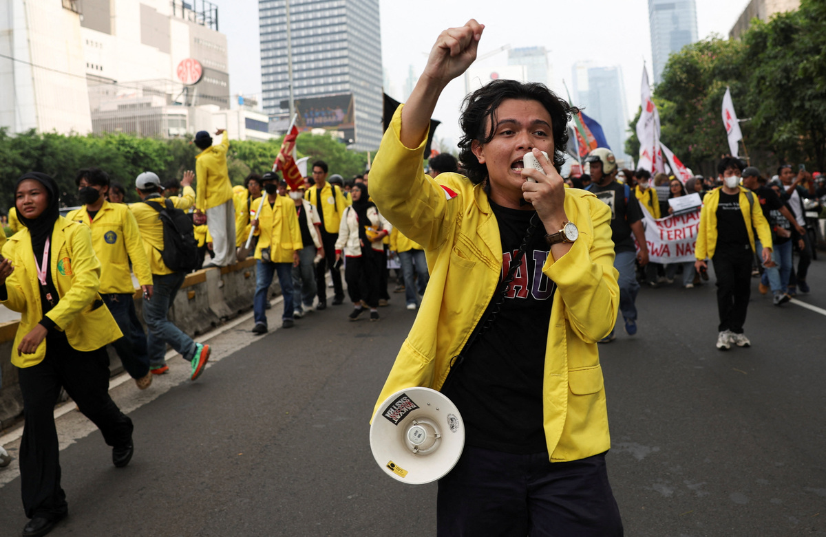 A student uses a megaphone to shout slogans during a protest against government policies, including state budget spending, a fuel price hike, a free meals programme, and expanded military roles in civilian affairs, in Jakarta, Indonesia, June 12, 2026. REUTERS/Ajeng Dinar Ulfiana