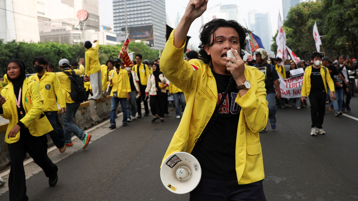 A student uses a megaphone to shout slogans during a protest against government policies, including state budget spending, a fuel price hike, a free meals programme, and expanded military roles in civilian affairs, in Jakarta, Indonesia, June 12, 2026. REUTERS/Ajeng Dinar Ulfiana