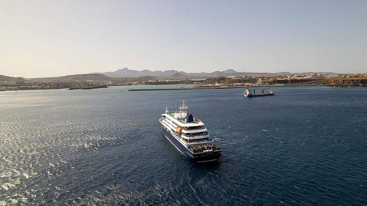 The cruise ship MV Hondius sits off the port of Praia, Cape Verde, on Sunday. An outbreak of suspected hantavirus, a family of viruses that can cause hemorrhagic fever, on board a cruise ship in the Atlantic Ocean has left three people dead, one in intensive care and two crew members with “acute respiratory symptoms.” Cape Verde is about 310 miles off the western coast of Senegal.