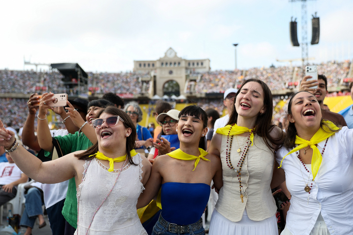 Women listen to a concert ahead of a prayer vigil at the Lluis Companys Olympic Stadium, during Pope Leo's apostolic journey, in Barcelona, Spain, June 9, 2026. REUTERS/Bruna Casas