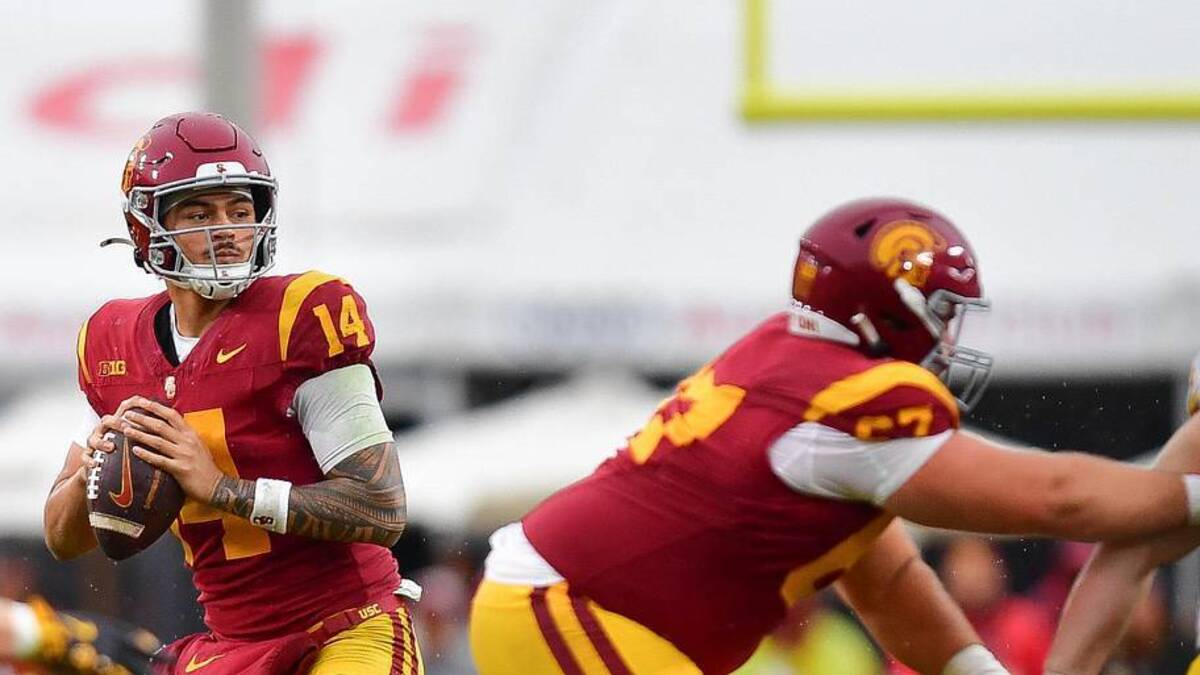 Nov 15, 2025; Los Angeles, California, USA; Southern California Trojans quarterback Jayden Maiava (14) drops back to pass against the Iowa Hawkeyes during the second half at the Los Angeles Memorial Coliseum. Mandatory Credit: Gary A. Vasquez-Imagn Images | Gary A. Vasquez-Imagn Images 