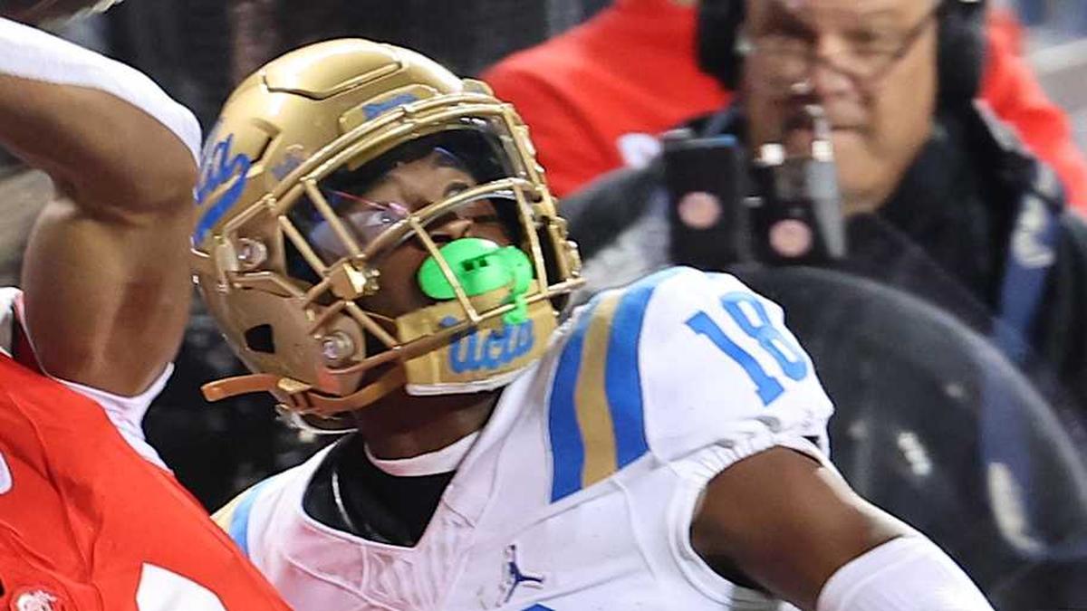  Nov 15, 2025; Columbus, Ohio, USA; Ohio State Buckeyes wide receiver Quincy Porter (11) attempts to catch the ball as UCLA Bruins defensive back Rodrick Pleasant (18) interferes on the play during the second quarter at Ohio Stadium. Mandatory Credit: Joseph Maiorana-Imagn Images | Joseph Maiorana-Imagn Images 