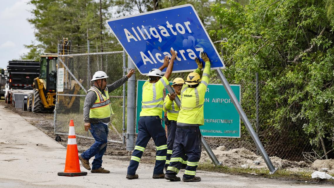 Workers install a permanent Alligator Alcatraz sign on July 3 in Collier County.