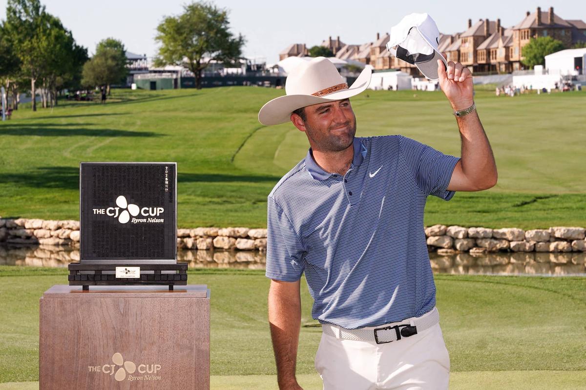  Scottie Scheffler celebrates with the winner's trophy after the final round of the THE CJ CUP Byron Nelson tournament in McKinney, Texas, on May 4, 2025. Raymond Carlin III-Imagn Images
