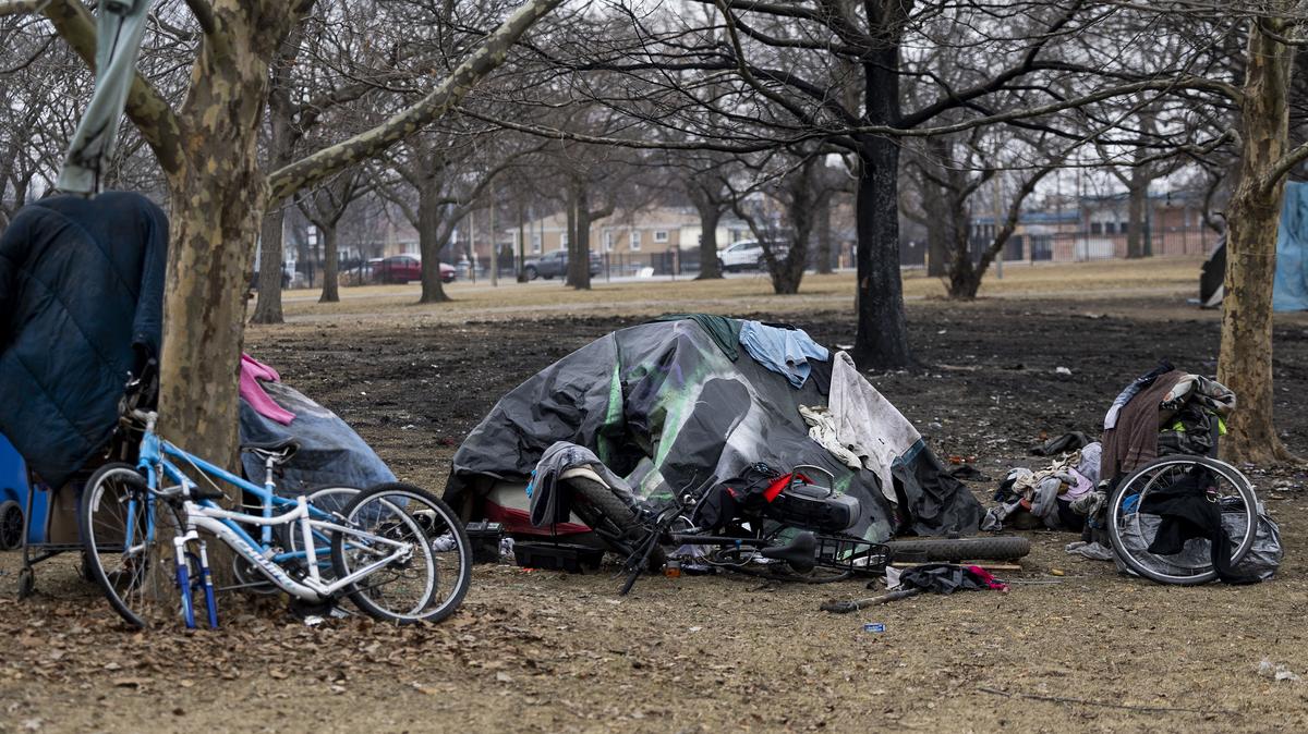 Tents sit near a burned section of ground in a homeless encampment in Legion Park in the North Park neighborhood of Chicago on March 4, 2026. (Eileen T. Meslar/Chicago Tribune/TNS)