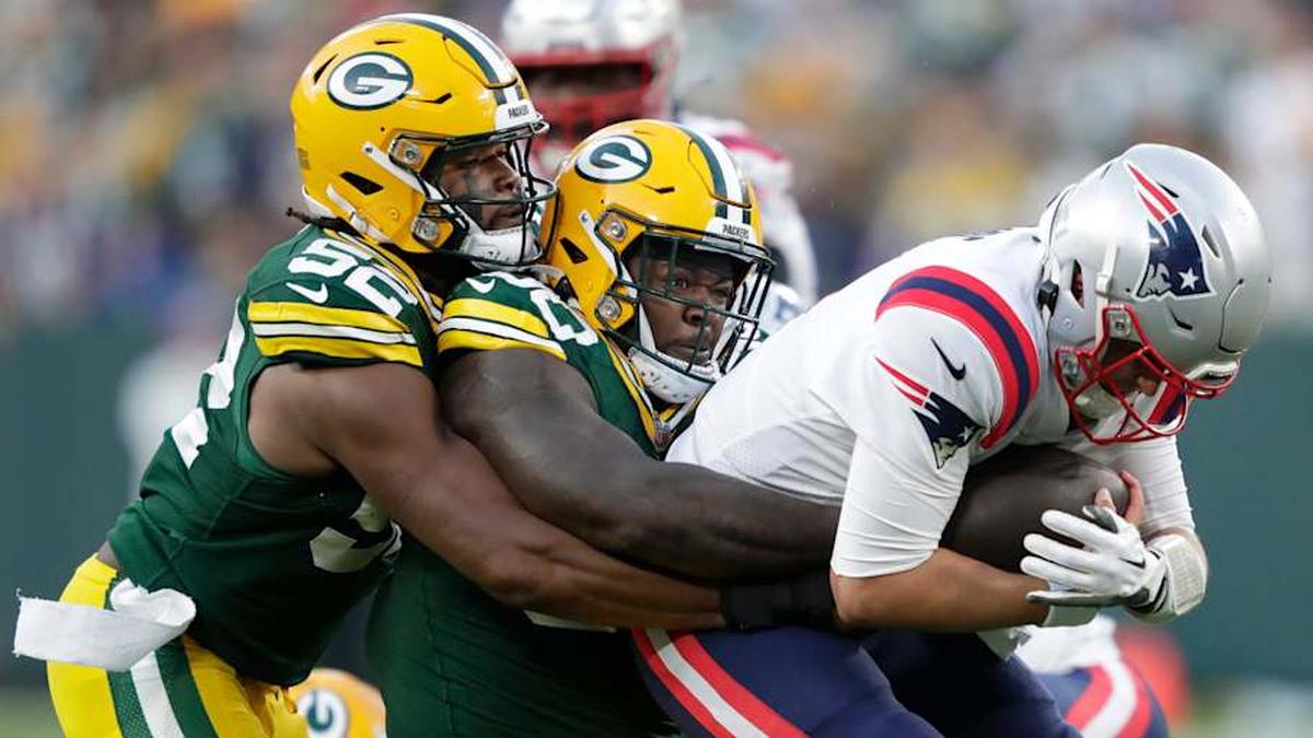  New England Patriots quarterback Bailey Zappe (4) is sacked by Green Bay Packers defensive tackle Jarran Reed (90) as linebacker Rashan Gary (52) helps on the play during their football game Sunday, October 2, at Lambeau Field in Green Bay, Wis. Dan Powers/USA TODAY NETWORK-Wisconsin Apc Packvspatriots 1002222031djp | Dan Powers/USA TODAY NETWORK-Wisconsin / USA TODAY NETWORK 