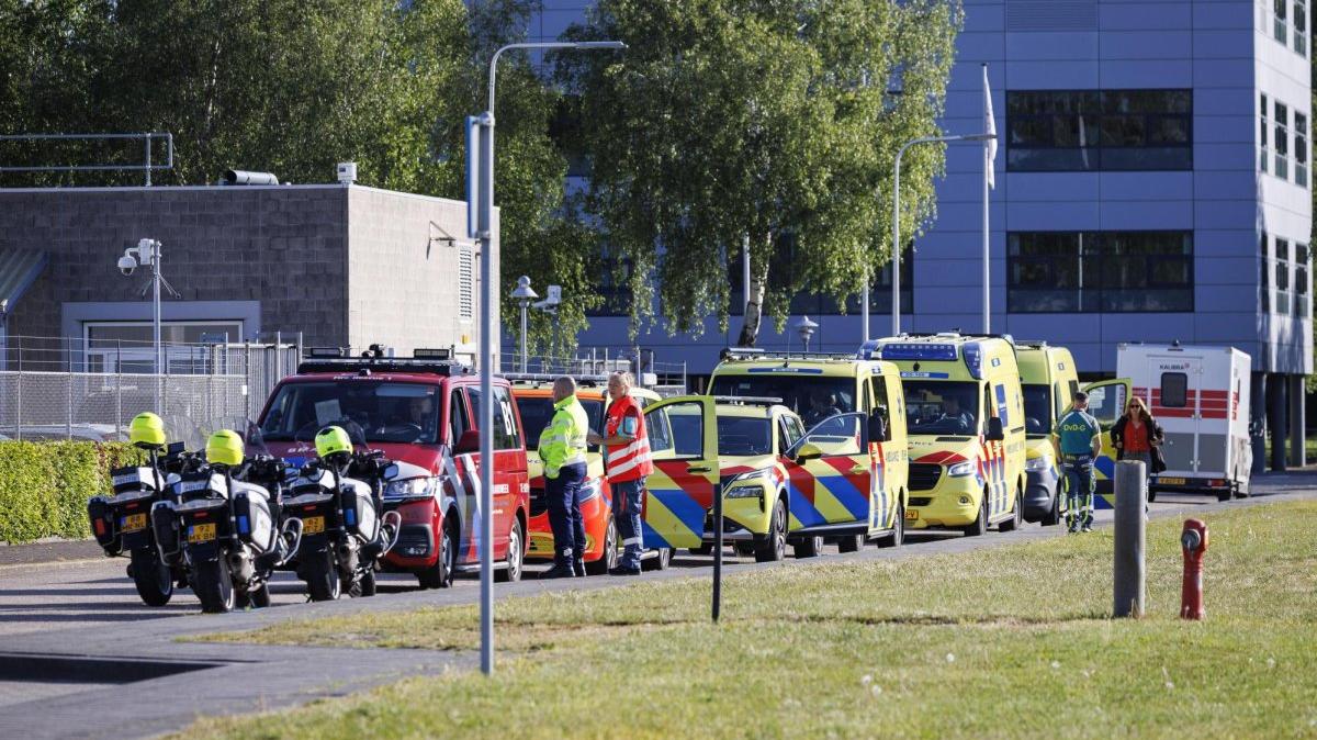 Ambulances and police at Amsterdam's Schiphol airport stand by to transport a British hantavirus patient evacuated from the cruise ship Hondius. On Friday, British authorities said they believed a third Briton had contracted the virus. File Photo by Michel van Bergen/EPA