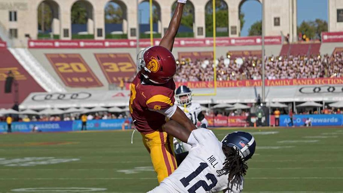  Sep 6, 2025; Los Angeles, California, USA; USC Trojans wide receiver Ja'Kobi Lane (8) makes a one handed catch for a touchdown as he is defended by Georgia Southern Eagles defensive back Tracy Hill Jr. (12) during the first quarter at United Airlines Field at Los Angeles Memorial Coliseum. Mandatory Credit: Jayne Kamin-Oncea-Imagn Images | Jayne Kamin-Oncea-Imagn Images 